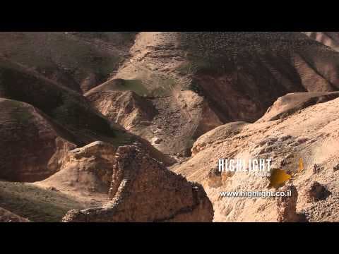 LN 028 Israel stock footage library: Tilt up over ruins and mountain in the Negev Desert at winter