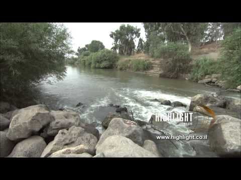 LN 023 Israel stock footage library: Jordan River, with a slow summer stream