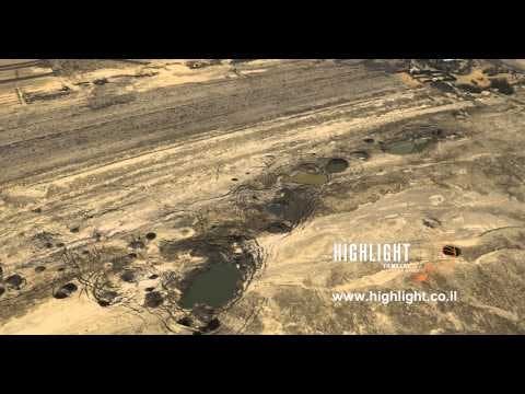 AD4K 016 - Aerial 4K Dead Sea: Dead Sea sinkholes, sun reflection, fly back to wide