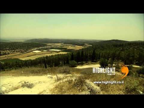 LN 071 Israel stock footage library: Open shot of trees and fields in the Galilee at summer